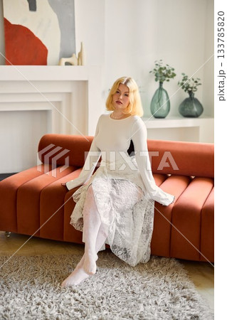 Woman with flowers, Seated woman holding tulips in modern 133785820