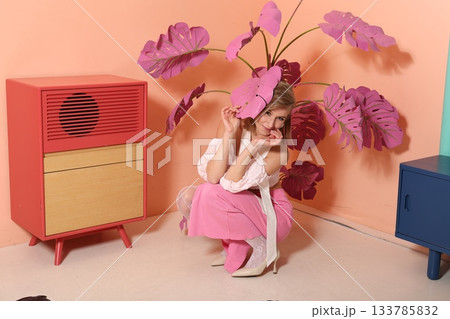 Fashion enthusiast in colorful vintage setting with creative styling 133785832