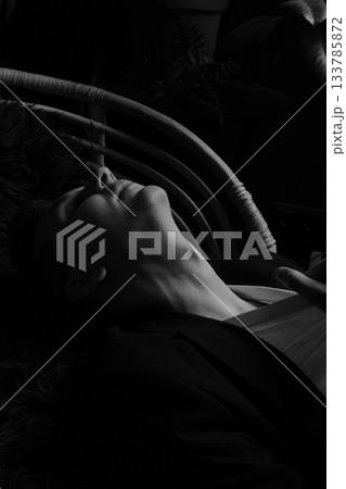Quiet silhouette with closed eyes immersed in vibrant plant life Quiet silhouette with closed eyes immersed in vibrant plant life 133785872