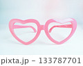 pink heart shape of glasses on white background 133787701
