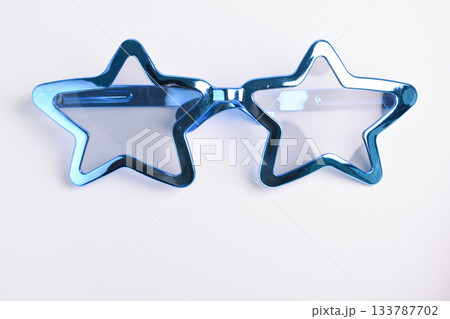 blue star shape of glasses on white background blue star shape of glasses on white background 133787702