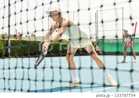Senior woman plays tennis 133787754