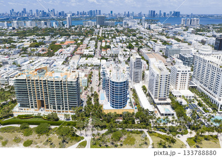 Miami beach with turquoise waters. Aerial view of sandy coastline and waves. Tropical Miami Beach scene with sandy beach. Oceanfront of South Miami. Miami beach with turquoise waters. Aerial view of sandy coastline and waves. Tropical Miami Beach scene with sandy beach. Oceanfront of South Miami. 133788880