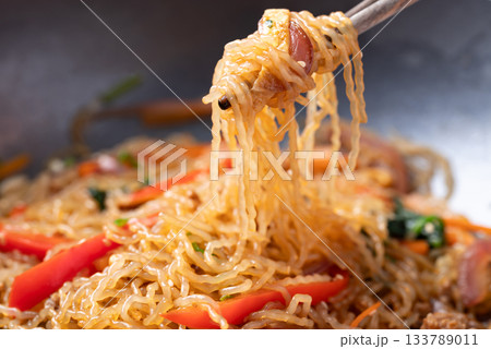 Japchae, Korean stir fried glass noodles with vegetables, pork, soy sauce and sesame oil Japchae, Korean stir fried glass noodles with vegetables, pork, soy sauce and sesame oil 133789011