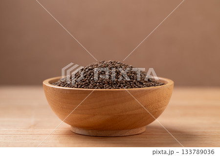 Dried perilla seed in a bowl on wooden background 133789036