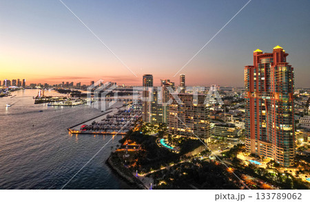 Marina Bay filled with vessels and yacht in Miami. Summer vacation scene with yachts by the oceanfront. Skyline with yachts in Miami. Florida coastline from above with boats. Boat trip in the Miami. Marina Bay filled with vessels and yacht in Miami. Summer vacation scene with yachts by the oceanfront. Skyline with yachts in Miami. Florida coastline from above with boats. Boat trip in the Miami. 133789062