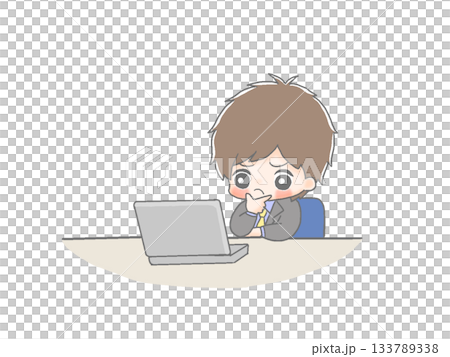 A male office worker thinking in front of a computer 133789338