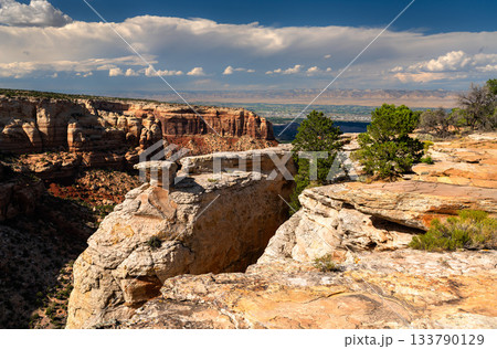 View from Cold Shivers Point Overlook in Colorado National Monument. White sandstone is in the foreground, with Columbus Canyon and the Grand Valley below View from Cold Shivers Point Overlook in Colorado National Monument. White sandstone is in the foreground, with Columbus Canyon and the Grand Valley below 133790129