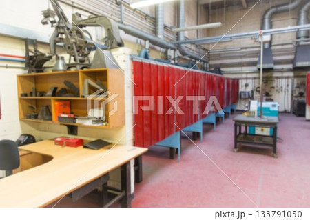 Flat design showing metal workshop with red welding curtains, desk, shelf, mobile cart, ducts Flat design showing metal workshop with red welding curtains, desk, shelf, mobile cart, ducts 133791050