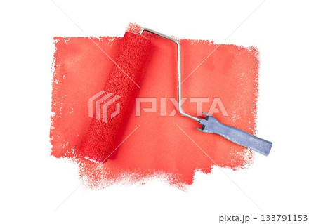 Red paint roller against white background Red paint roller against white background 133791153