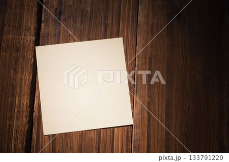 White paper fallen on wooden floor 133791220