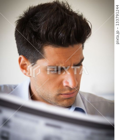 Casual businessman reading newspaper Casual businessman reading newspaper 133791244