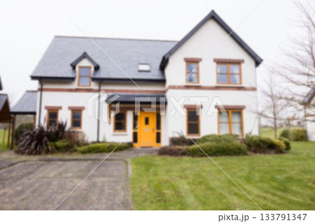 Facade of white house against sky 133791347