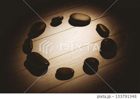 Pebbles on hardwood floor 133791348
