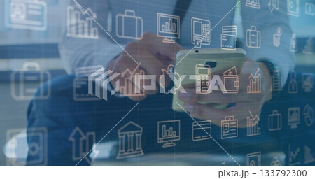 Holding smartphone, business professional tapping screen at glass-topped desk, with financial icons Holding smartphone, business professional tapping screen at glass-topped desk, with financial icons 133792300