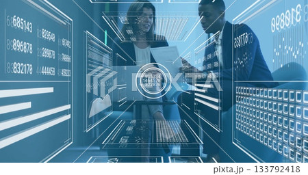 In office, business professionals analyzing data with digital interface overlay In office, business professionals analyzing data with digital interface overlay 133792418