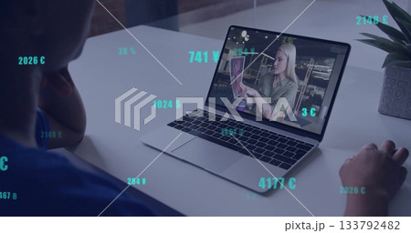 Watching image of floating currency symbols, person on image call with laptop Watching image of floating currency symbols, person on image call with laptop 133792482