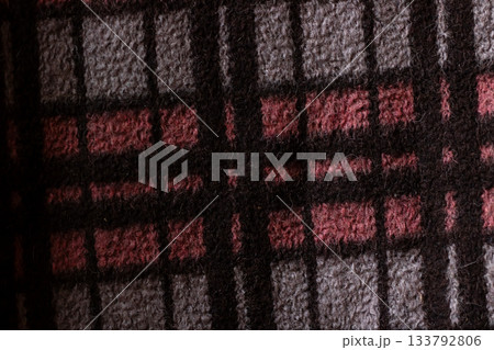 Rich dark woven plaid pattern with subtle grain cultivating cozy aesthetic for design applications 133792806