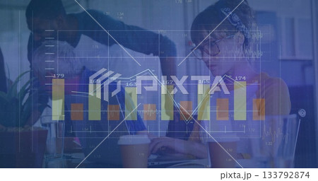 Reviewing team of five analyzing holographic financial charts in office, with laptop and coffee 133792874