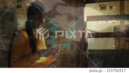 Leaning woman in mustard top viewing data overlay in rail carriage, with smartphone and wooden beam Leaning woman in mustard top viewing data overlay in rail carriage, with smartphone and wooden beam 133792917