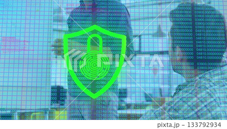 IT specialists monitoring network intrusions in office with headsets, shield icon and binary grid IT specialists monitoring network intrusions in office with headsets, shield icon and binary grid 133792934