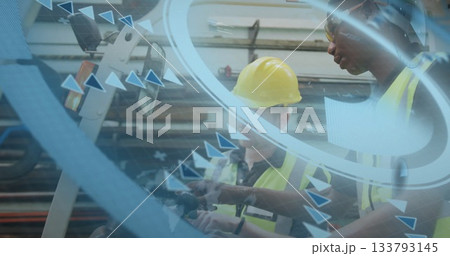 Inspecting men wearing yellow hard hats examining control panel in plant, with interface overlay Inspecting men wearing yellow hard hats examining control panel in plant, with interface overlay 133793145