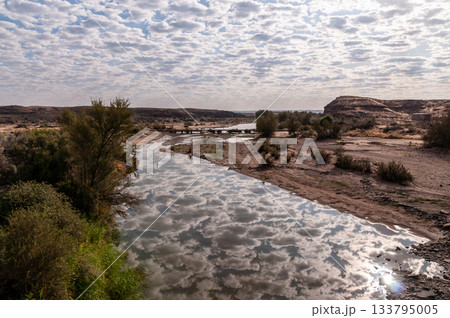 Clouds reflected in the Fish river 133795005