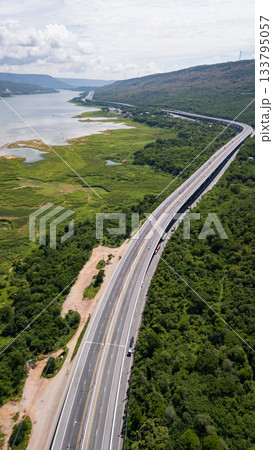 Drone shot The M6 motorway Nakhon Ratchasima Province - Bang Pa-in Lam Ta Khong River and Mountain. Motorway Korat Thailand 133795057