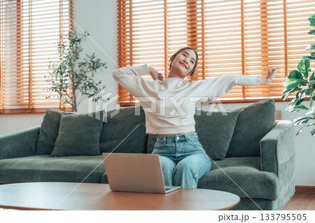 Young asian woman feeling pain in neck and shoulder after working on computer laptop for a long time Young asian woman feeling pain in neck and shoulder after working on computer laptop for a long time 133795505