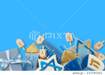 Decorative hanukkah cookies and dreidels on blue background 133795561