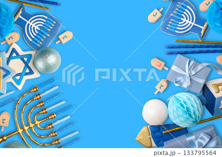 Hanukkah symbols including menorah, dreidels, and cookies 133795564