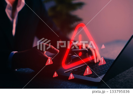 Cybersecurity alert with warning icon displayed on screen, representing digital threat, hacking risk, malware, phishing, and internet data breach in a modern online environment. Cybersecurity alert with warning icon displayed on screen, representing digital threat, hacking risk, malware, phishing, and internet data breach in a modern online environment. 133795836