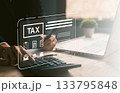 Close-up of hand using calculator with digital tax checklist interface, suitable for financial reports, income tax return, tax preparation, and online accounting services. 133795848