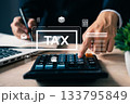 Close-up of hand pressing calculator with tax icons overlay, representing financial data analysis, tax return preparation, budgeting, and business accounting tasks. 133795849