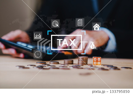 Close up of hands using calculator with stacked coins and tax icon, representing financial strategy, income planning, tax saving, personal finance, money management, and accounting. Close up of hands using calculator with stacked coins and tax icon, representing financial strategy, income planning, tax saving, personal finance, money management, and accounting. 133795850