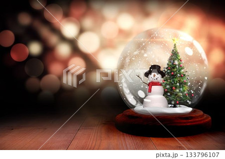 Christmas tree and snowman in snow globe 133796107