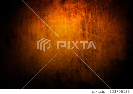 Abstract grunge texture is displaying mottled orange center fading to black edges, flat design Abstract grunge texture is displaying mottled orange center fading to black edges, flat design 133796128