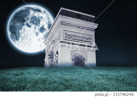 Bright moon over arc de triomph 133796248