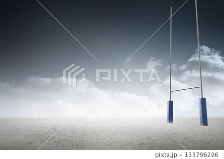 Flat design rugby goal posts with padded base are standing on cracked plain under overcast sky 133796296
