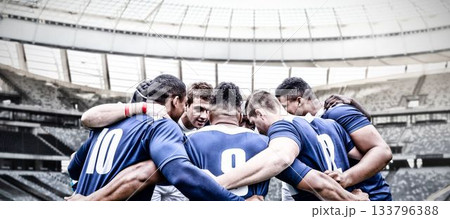 Multiracial male rugby players huddling and planning before match in stadium, copy space 133796388