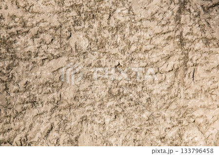 Textured rocky soil surface is being shown in flat design arid ground, highlighting fine cracks 133796458