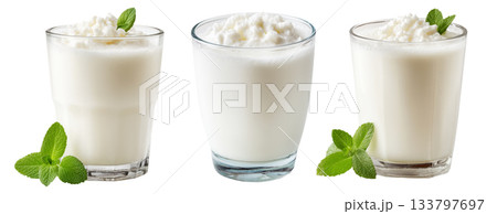 Ayran salted yogurt drink in tall glass with foamy top and mint leaf, isolated on white background, concept of healthy drink 133797697