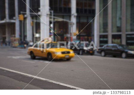 Yellow taxi cab is navigating busy urban street in flat design with black sedans, traffic lights Yellow taxi cab is navigating busy urban street in flat design with black sedans, traffic lights 133798113