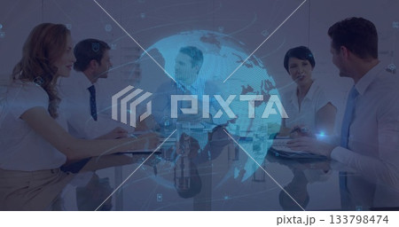 Discussing business team reviewing data in modern boardroom, with holographic globe projection Discussing business team reviewing data in modern boardroom, with holographic globe projection 133798474
