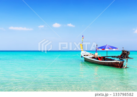 Traditional local long tail boat on a beautiful tropical beach in sunny day, in Phuket, Thailand 133798582