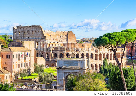The Colosseum is one of the main tourist attractions in Rome, Italy. View of the ancient Roman ruins of the Colosseum through the Roman Forum. Landscape of ancient Rome, Italy. The Colosseum is one of the main tourist attractions in Rome, Italy. View of the ancient Roman ruins of the Colosseum through the Roman Forum. Landscape of ancient Rome, Italy. 133798605
