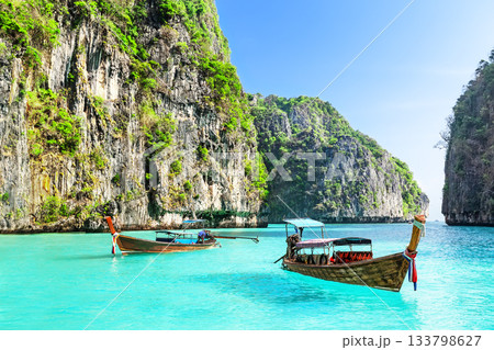 View of amazing landscape with two longtail boats of Loh Samah Bay on Phi Phi Island, Thailand. This small bay is on the other side of Maya Bay on Phi Phi Leh Island in Thailand. 133798627