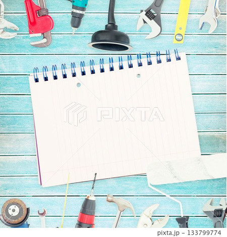 Tools and notepad on wooden background 133799774
