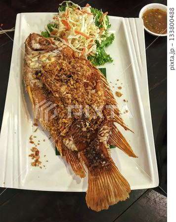 Fried fish with garlic Fried fish with garlic 133800488
