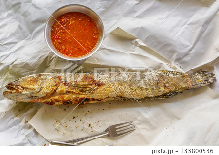 Grilled snakehead fish with salt 133800536
